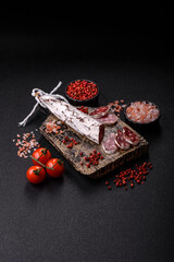 Dry Spanish salami sausage fuet as a snack for the dinner table. Fuet sausage