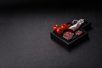 Dry Spanish salami sausage fuet as a snack for the dinner table. Fuet sausage