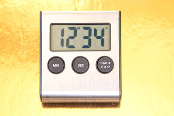 A sleek digital kitchen timer displays 12:34 on a bright yellow background. Features three buttons: MIN, SEC, START, and STOP. Ideal for cooking, baking, or timing tasks