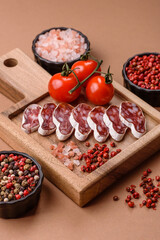 Dry Spanish salami sausage fuet as a snack for the dinner table. Fuet sausage