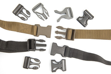 Fastex plastic clip for backpacks, bags, nylon belts on a white background. items and accessories for clothing and fixing tourist equipment