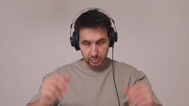 Youthful technician editing sound, Youthful sound engineer meticulously adjusting mixing console within modern streaming design setting to create perfect audio balance