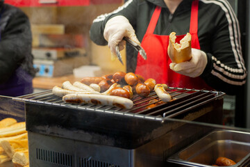 Grilled sausages on street food market