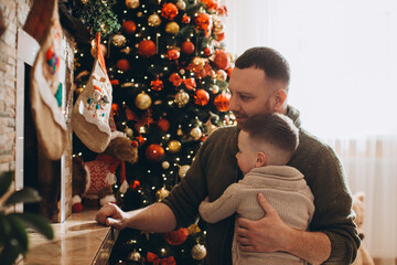 Father holding son sharing christmas holiday togetherness