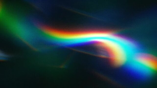 A vibrant abstract image with colorful wavy patterns in hues of green, blue, and red against a dark background.