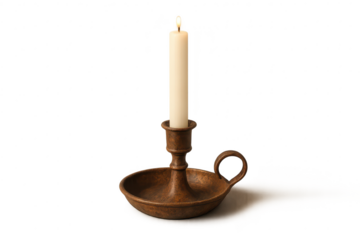 Lit white candle in antique bronze holder, transparent background, isolated.