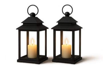 Pair of elegant black lanterns with lit candles isolated on a transparent background.