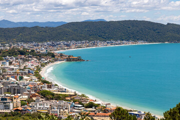Bombinhas and Bombas beaches with buildings, mountains and forest
