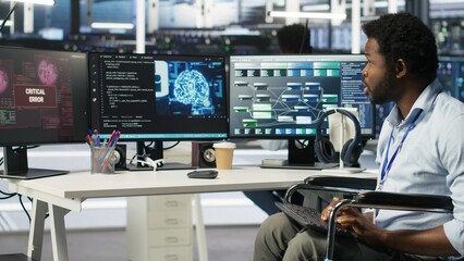 Stressed engineer with paraplegia in data center panicked by AI node tree software critical error. Anxious server hub worker in wheelchair worried by visual programming tool glitching, camera B