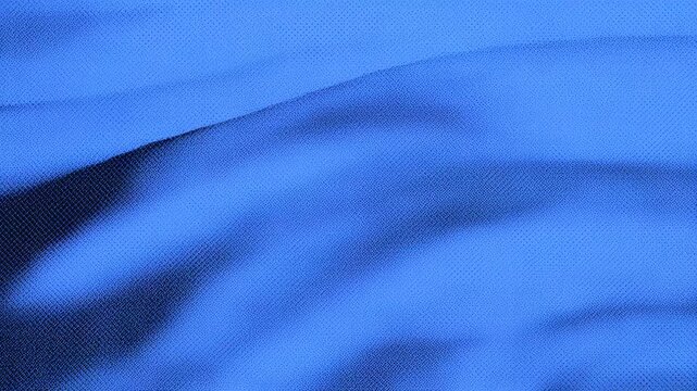 Close-up of a smooth, blue fabric showcasing gentle waves and textures.