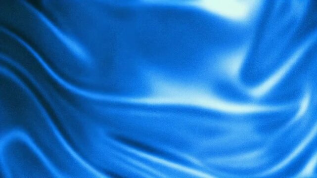 Abstract blue silk fabric with smooth flowing patterns and textures.