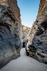 Passages between the rocky cliffs that are created at low tide on Las Catedrales Beach in Ribadeo, Lugo, Spain