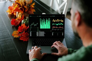 Middle Aged Day Trader Moving Around Downstairs of Home While Working Daily Trades on Stock Market Concept