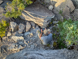 Drone Operator among Rocks and Vegetation at English Head, Anticosti,  Quebec, Canda