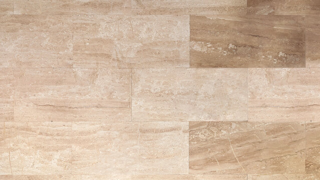 Beige polished and glossy travertine tile floor texture. Natural stone rectangular slab for interior surface background. Elegant modern tan porcelain tiles, veined slabs, home decor, interior design. 