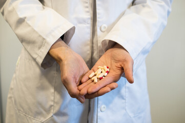 Doctor's Hands Holding Prescription Pills or Capsules, Medication Management and Treatment