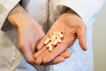 Doctor's Hands Holding Prescription Pills or Capsules, Medication Management and Treatment