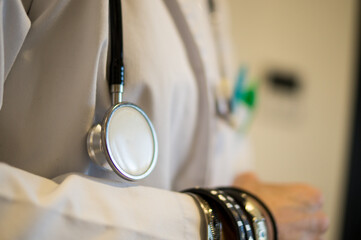 Physician with Excess Jewelry and Stethoscope, Violation of Sterility Protocols.