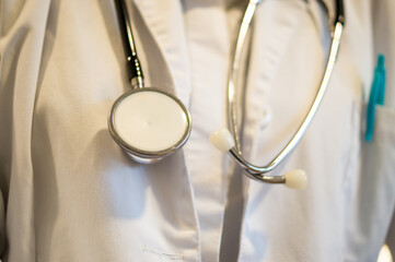 Close-up of Medical Professional in White Lab Coat with Stethoscope, Healthcare Concept.