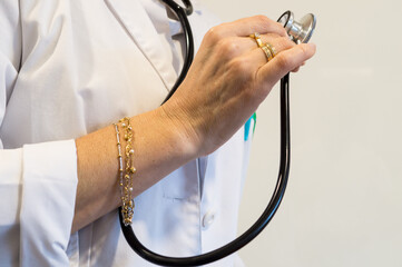 Physician with Excess Jewelry and Stethoscope, Violation of Sterility Protocols