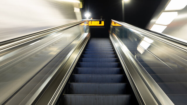 Escalator in Duesseldorf - Art Picture with movement - Into the Unknown. High quality photo