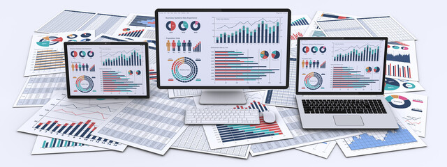 ビジネス資料とデータを表示したパソコン