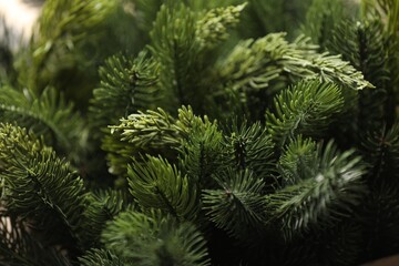 Branches of artificial Christmas tree as background, closeup