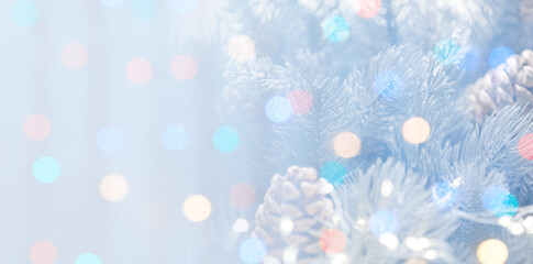 Christmas greeting card with fir tree branches and bokeh lights. Banner design