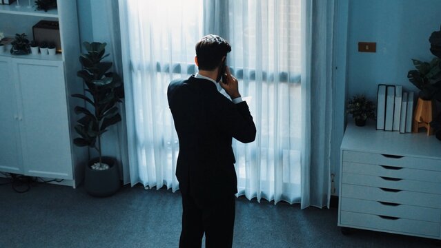 Top view of smart male leader calling phone while project manager give financial document. Businessman talking to investor to brainstorm idea by phone while looking at data analysis. Directorate. - Powered by Adobe
