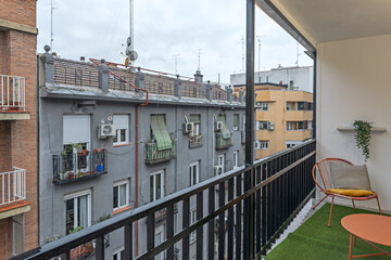 Obraz premium Winter terrace with an outdoor fireplace, thermal blankets, and a glass enclosure for enjoying the colder months