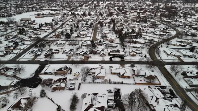 4K Aerial Establishing Shot of a Quiet, Snow-Covered Residential Neighborhood in Orland Park, Illinois, Mid-Winter