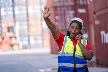 Warehouse worker directs operations shipping dock action photo industrial environment side view logistics efficiency