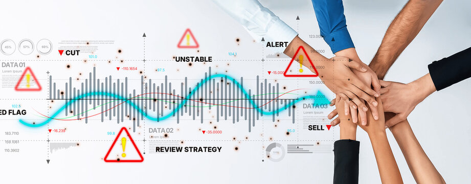 A diverse team collaborates on financial data analysis, combining hands and graphs to showcase alerts and strategies for informed decision making and effective planning. Trope - Powered by Adobe