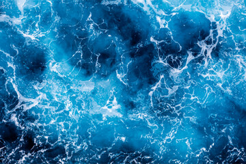 Obraz premium Sea water texture. Top view of picturesque water with foam. Can be used in covers, packaging, posters, textures, brochures, art and design projects. Mesmerizing vector illustration.