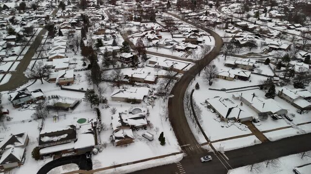 4K Aerial Establishing Shot of a Quiet, Snow-Covered Residential Neighborhood in Orland Park, Illinois, Mid-Winter
