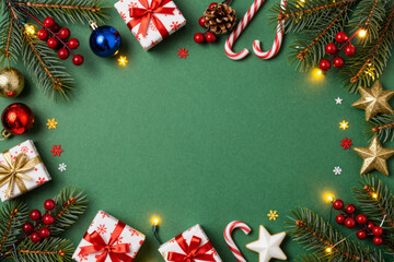 Festive Christmas border with traditional decorations, glowing lights, and gift boxes on a vibrant green background, ideal for seasonal greetings