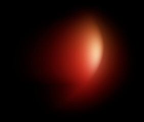 Soft orange light blur vertical oval on black background