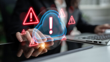 Red alert triangles over a blue cloud icon, symbolizing cloud security threats, system warnings,...