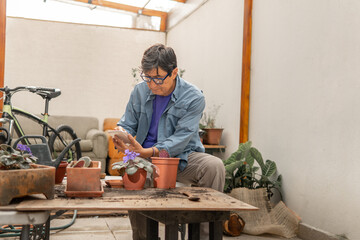 Man using tablet learning about home gardening