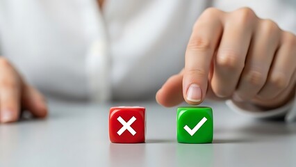 Hand choosing between a red cross and a green checkmark on cubes