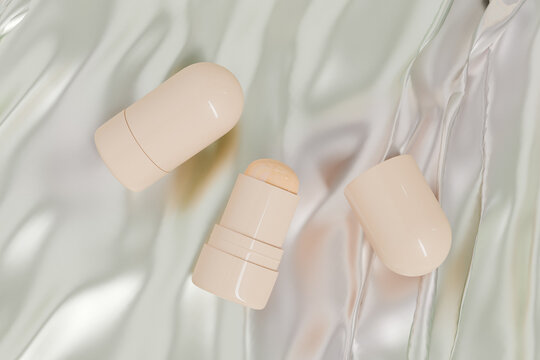 Cosmetic foundation Stick mockup, makeup twist up tube packaging, trendy Sunscreen Stick Tubes with close cap, Cylindrical pipstick Packaging, round shape Rotating Solid lip balm container in beige