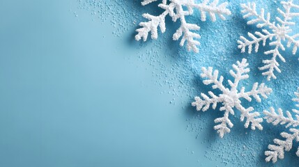 Clean Winter Holiday Composition: Glittering Snowflakes Bordering a Bright Blue Surface with Ample Copy Space for Text.