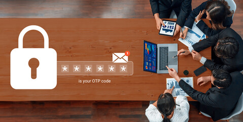 Professionals engage in a collaborative setting to ensure secure online transactions using OTP code verification, emphasizing teamwork and advanced technology. Gantry