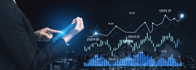 A business professional uses a tablet to analyze key financial data against a dark city skyline, showcasing digital graphs that illustrate market trends and statistics. Scalp
