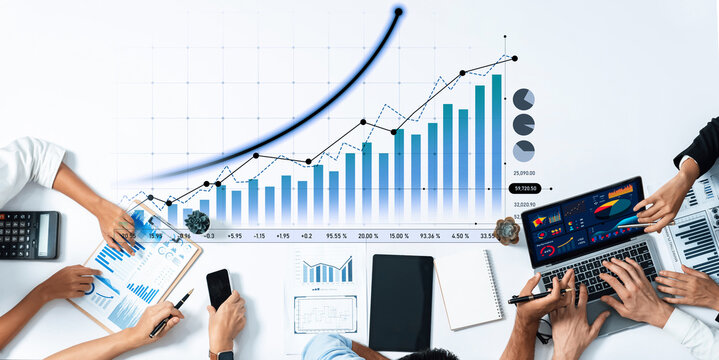 A dynamic scene of business professionals analyzing financial data with various charts and technology, highlighting teamwork and strategic planning for growth. Scalp