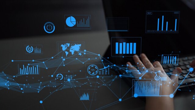 A modern workspace shows hands typing on a laptop surrounded by digital graphs and charts. This image captures the essence of data analysis and innovation in the digital age. Xenic - Powered by Adobe