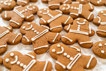 Decorating Gingerbread Man Cookies with Royal Icing for Festive Occasions