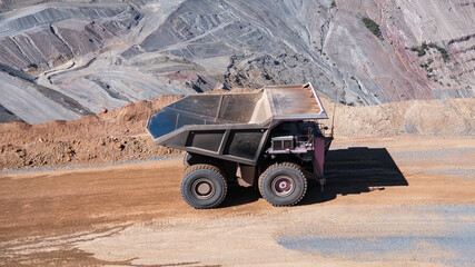 Mining dump truck in the process of transporting minerals from the bottom of the mine to the open pit © WILL PHOTOGRAPHY