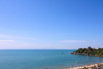 High Angle View of a Tropical Beach Bay with Clear Turquoise Water and Blue Sky Copy Space