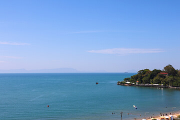 High Angle View of Tropical Bay and Seascape with Distant Mountains and Beach